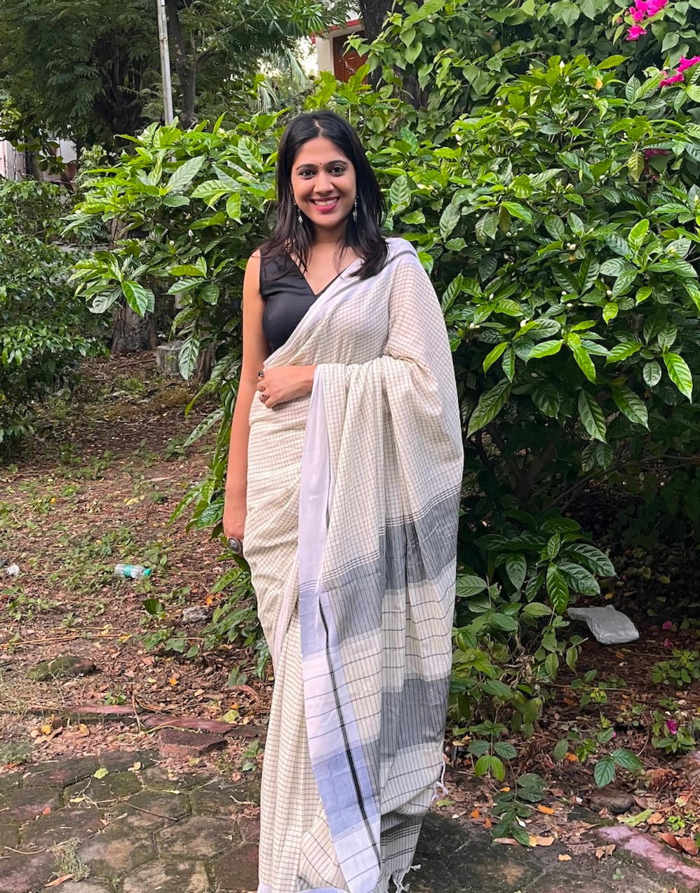 Off White Mul Cotton Saree with Black Checks All Over Saree Handloom saree, handcrafted saree, daily wear saree, office saree, affordable saree, saree for summers, Suta sarees, Eternity by Sakshi Sarees,