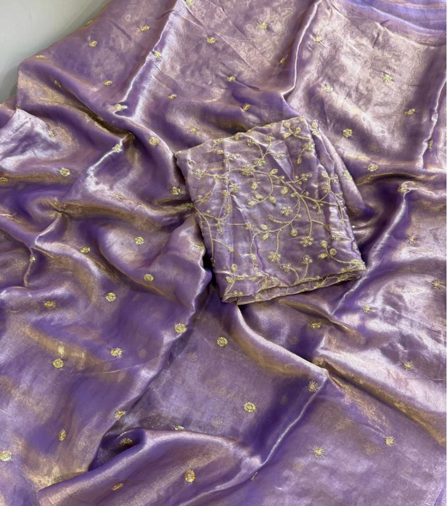 Purple silk-like fabric with small gold floral motifs and a matching embroidered fabric piece
