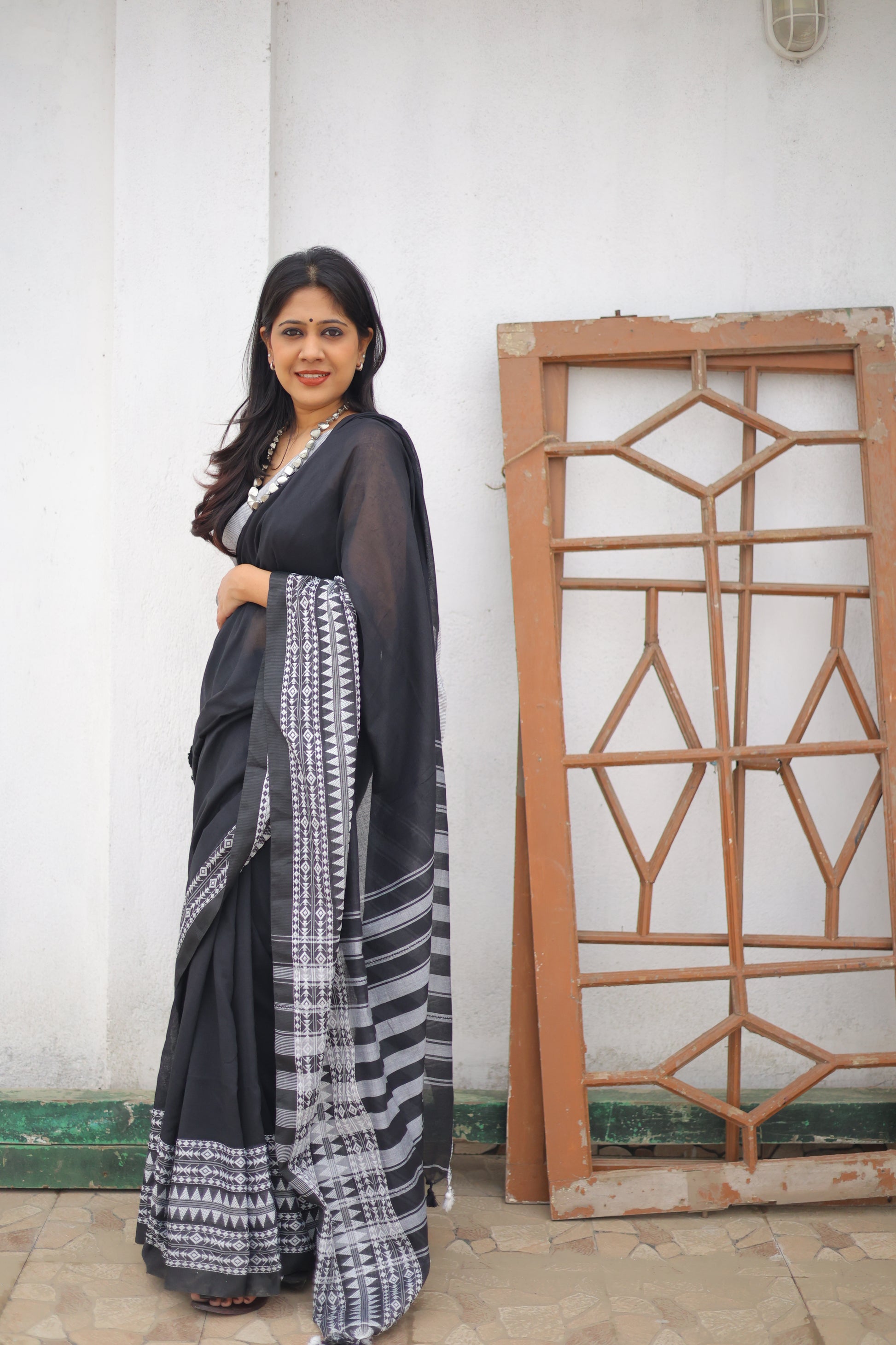 Black Mul Cotton Saree with Heavy Embroidered Border and Tassels Saree Handloom saree, handcrafted saree, daily wear saree, office saree, affordable saree, saree for summers, Suta sarees, Eternity by Sakshi Sarees,