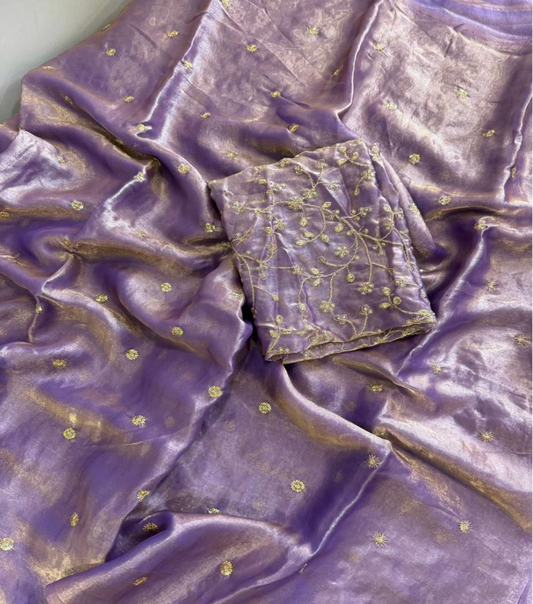 Purple silk-like fabric with small gold floral motifs and a matching embroidered fabric piece